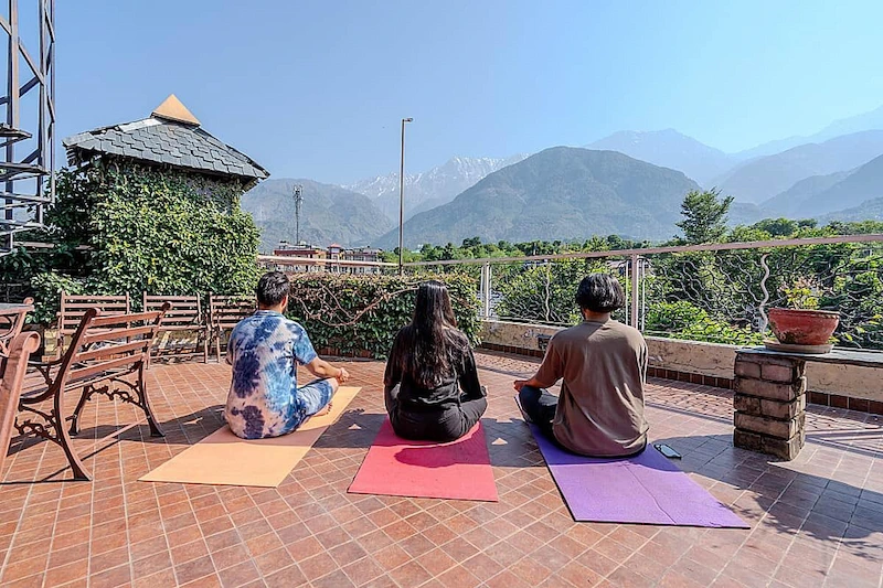 A quiet spiritual moment facing the Himalayan peaks
