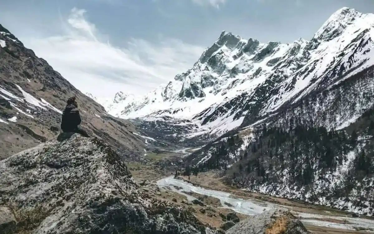 Har Ki Dun valley in summer with lush green meadows and Swargarohini peaks