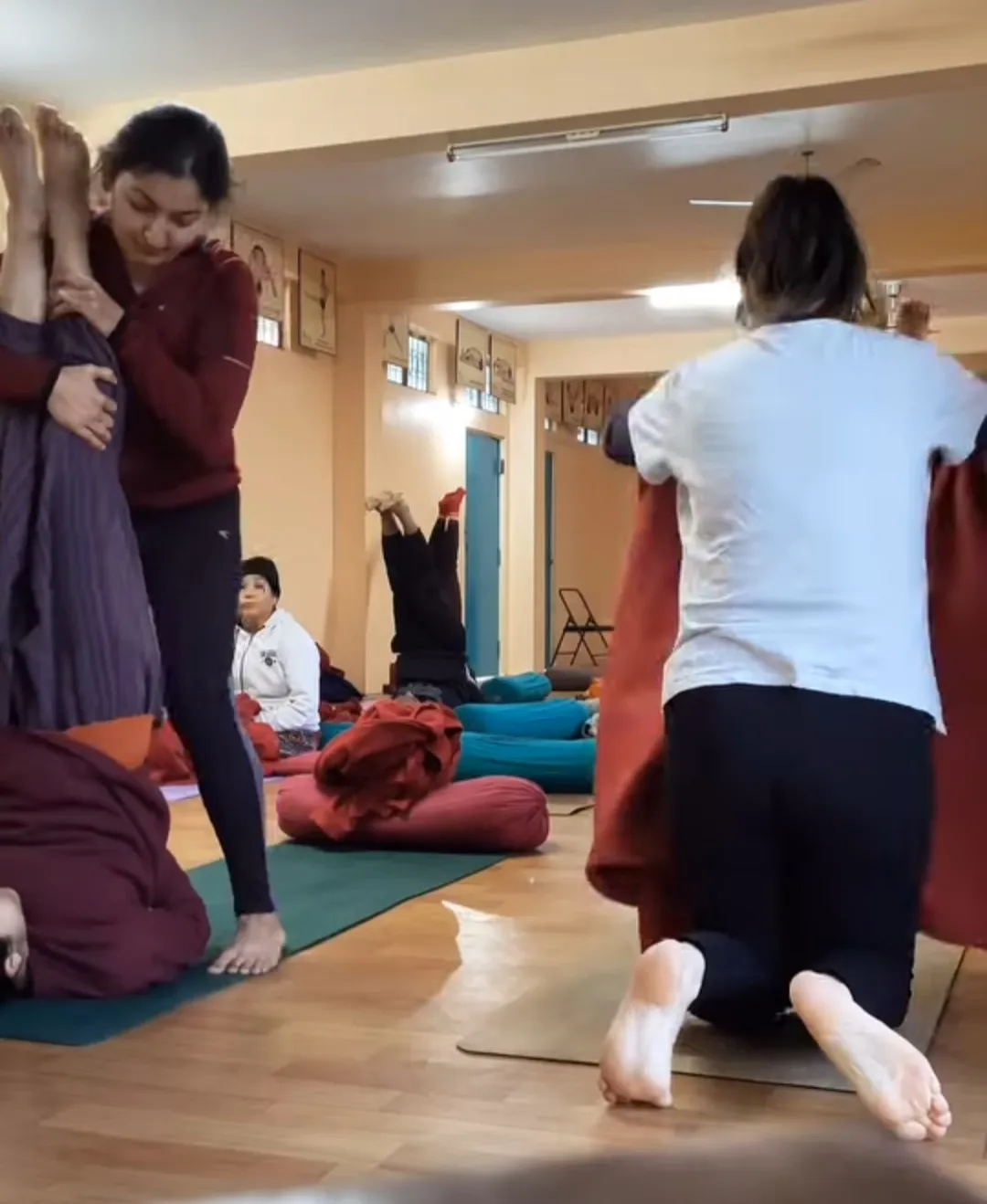 Yoga assisted inversion pose in Rishikesh