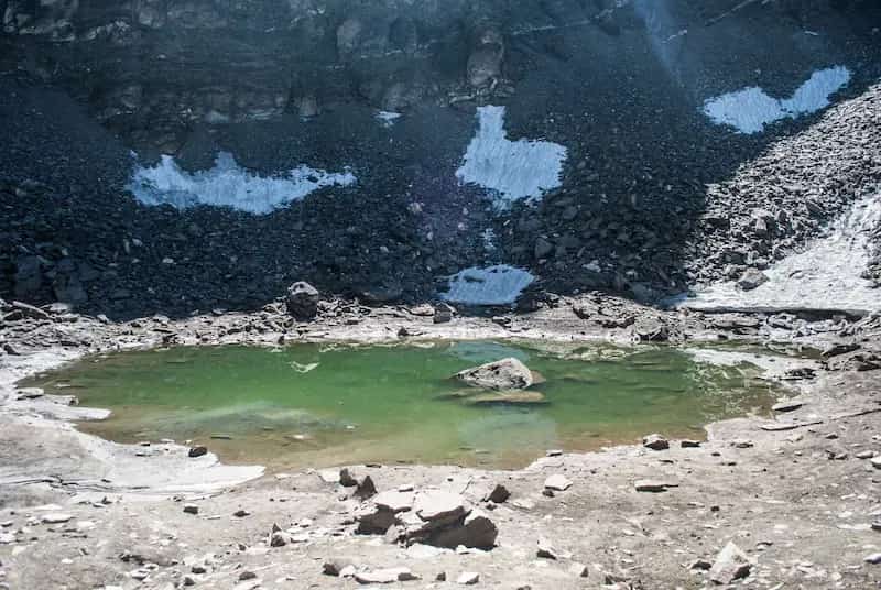 Looking down into the frozen bowl of Roopkund Lake