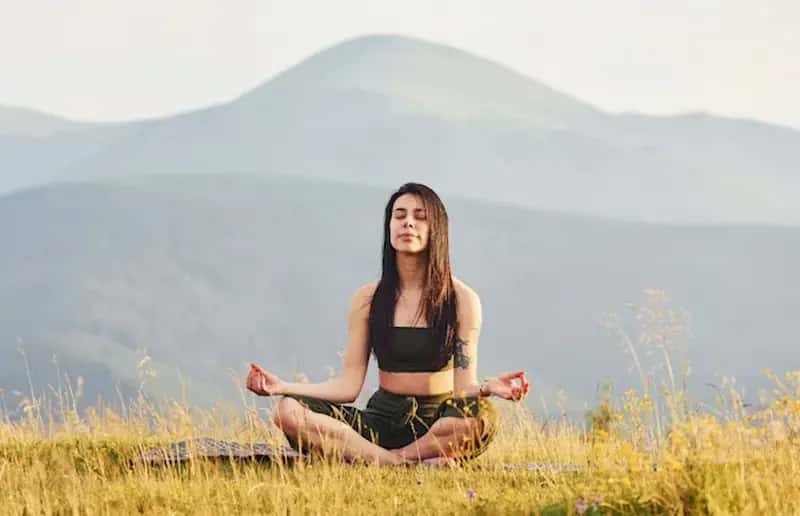 Sunrise yoga practice at a Himalayan retreat — movement and breath in mountain silence