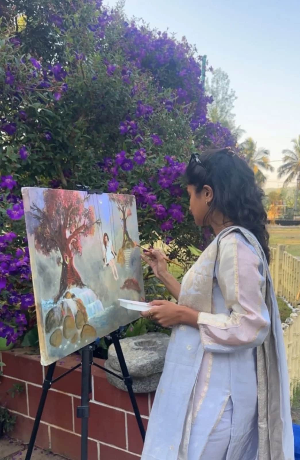 Outdoor easel painting during a real Himalayan art retreat