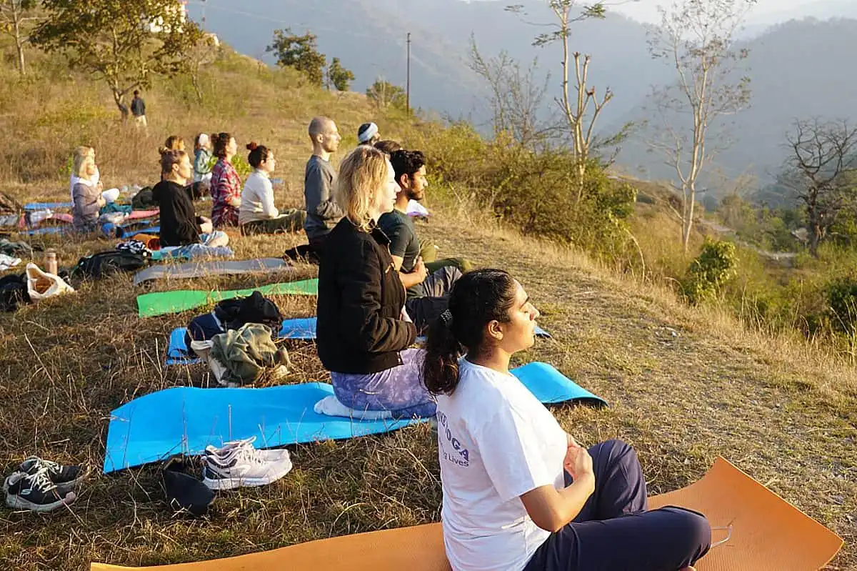 Group meditation session during a Himalayan silent retreat — guided practice in mountain setting